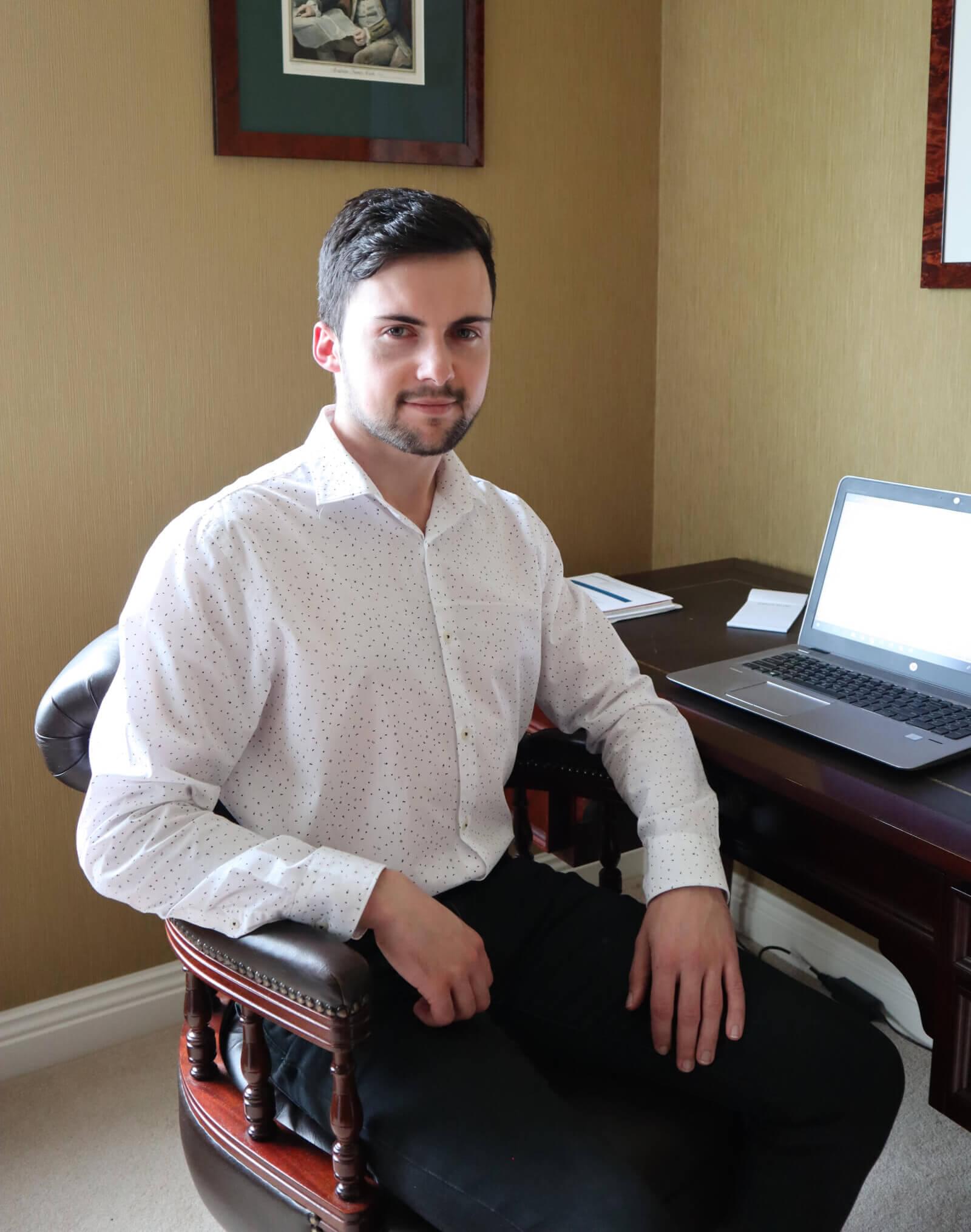 Dylan Sigley at his desk